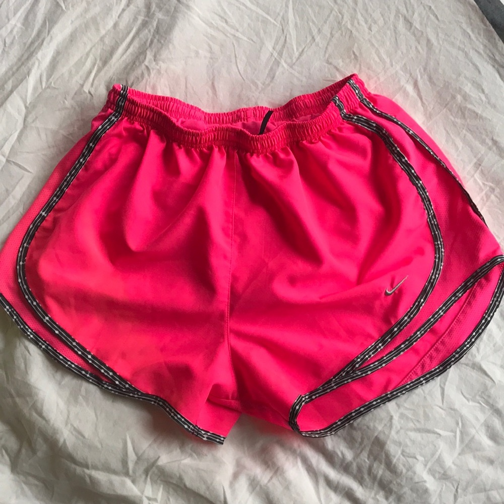 Neon pink Nike running shorts
